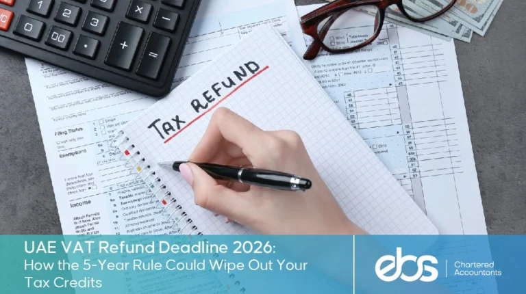 A person calculating a tax refund next to a calculator and eyeglasses, featuring text about the UAE VAT 5-year rule for 2026.